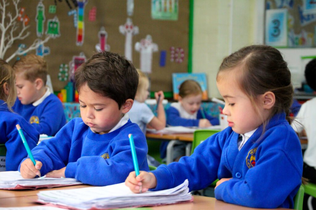 head-curriculum 2 pupils in year 1 writing in english class at horton kirby primary school