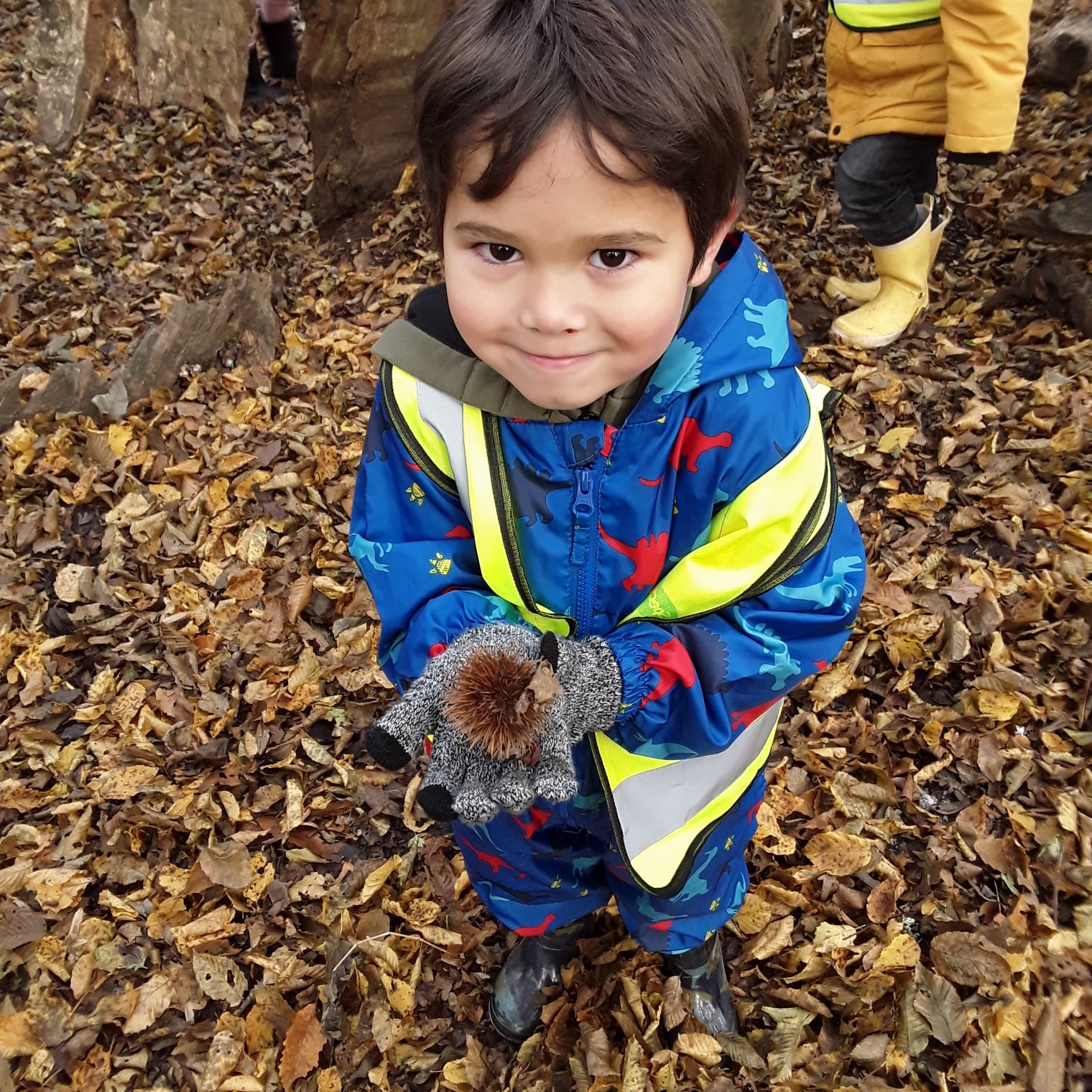 pupil shows pinecone in forest school at horton kirby primary school
