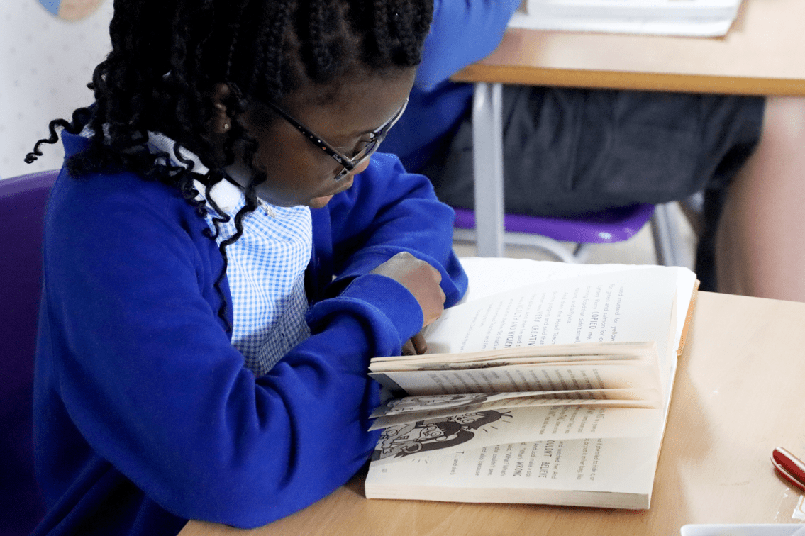 reading pupil reading a book at horton kirby primary school