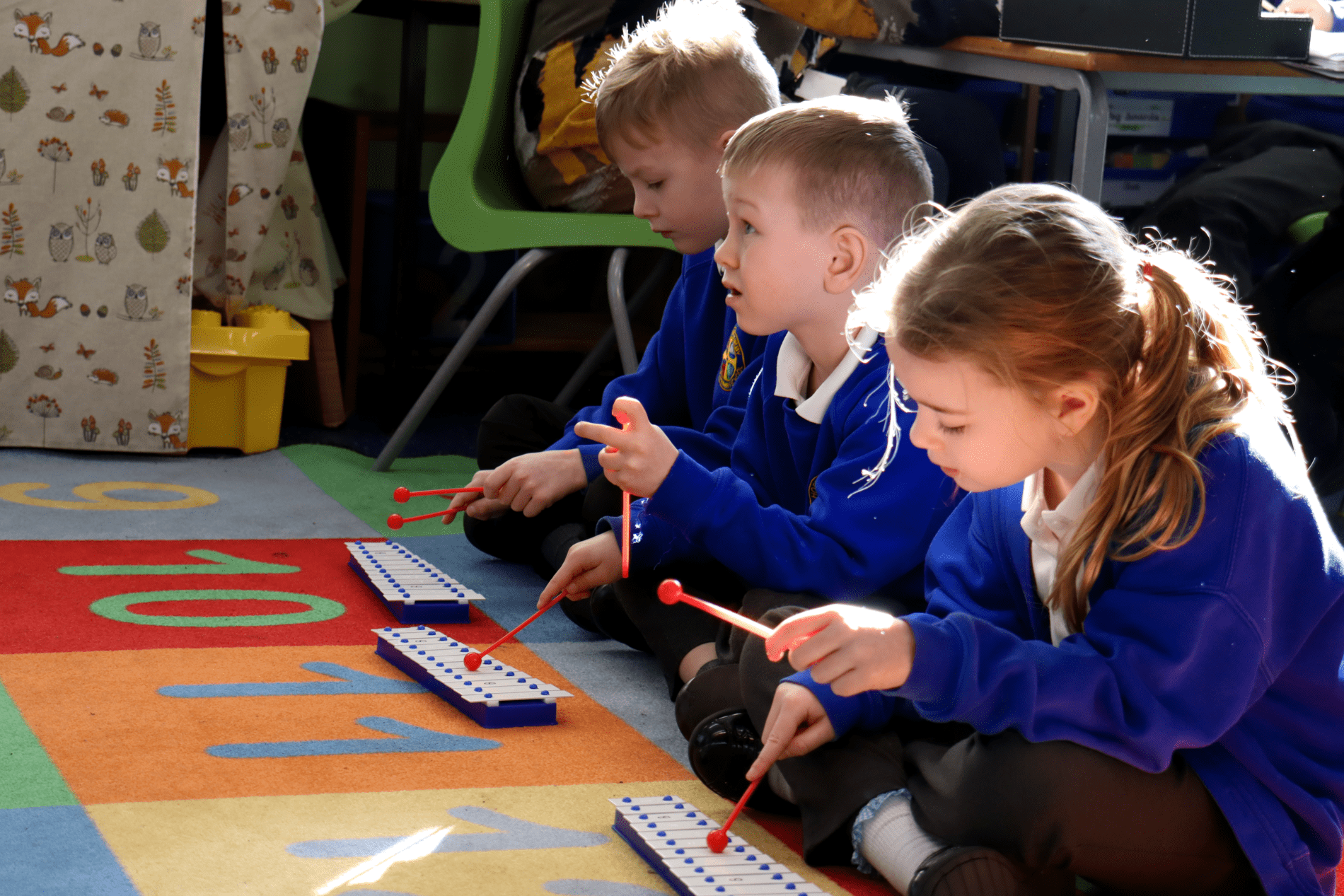 Music kids playing xylophones in music lesson at horton kirby primary school