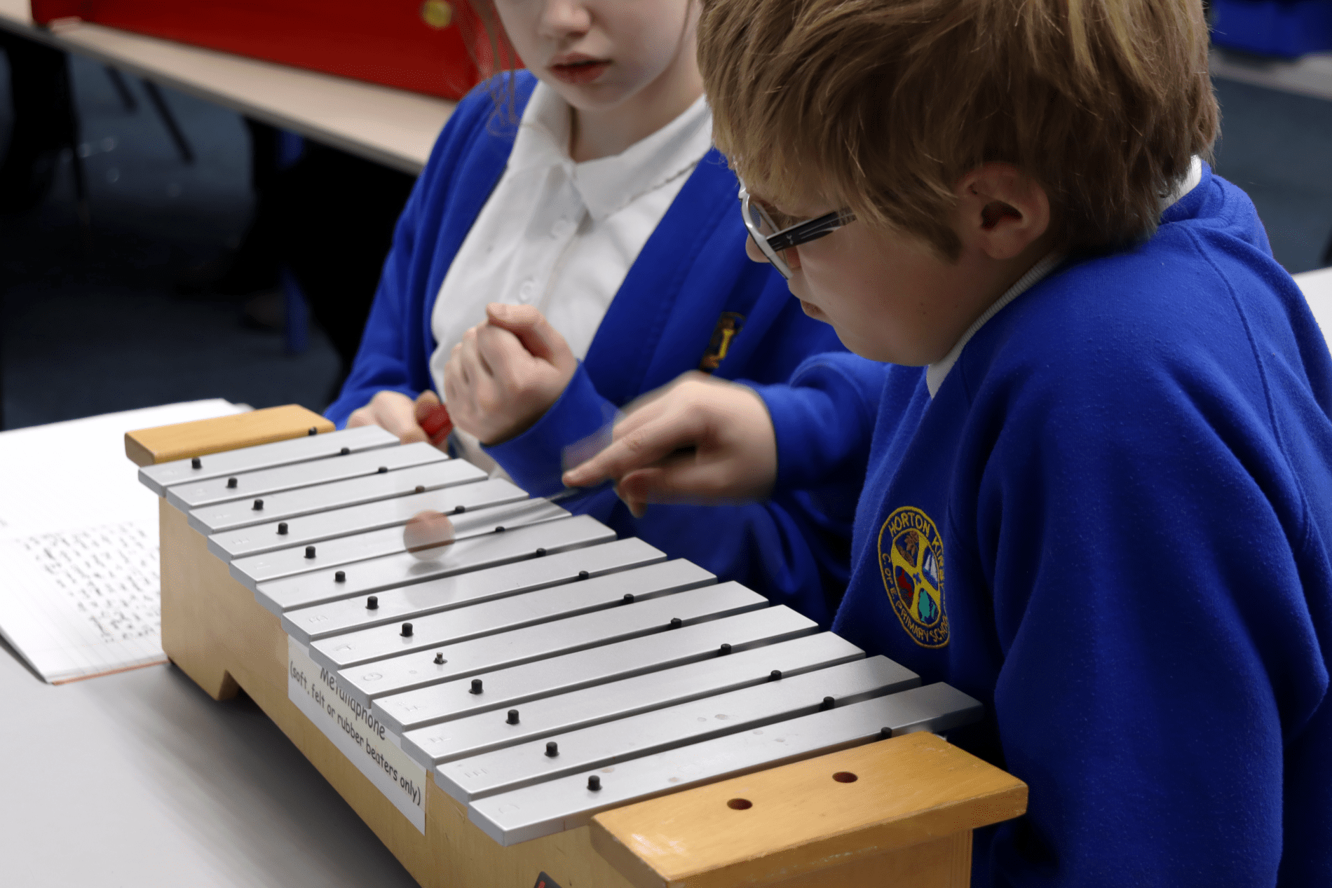 xylophones pupils playing the xylophones in a music lesson at horton kirby primary school