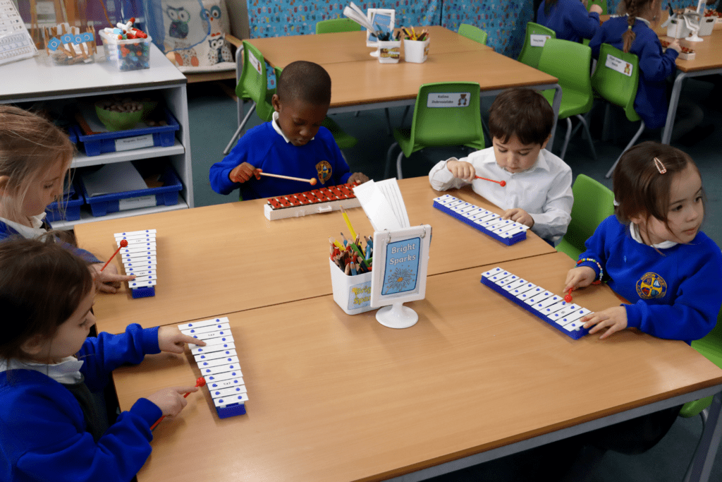 Music group group of pupils playing the xylophones in a music lesson at horton kirby primary school