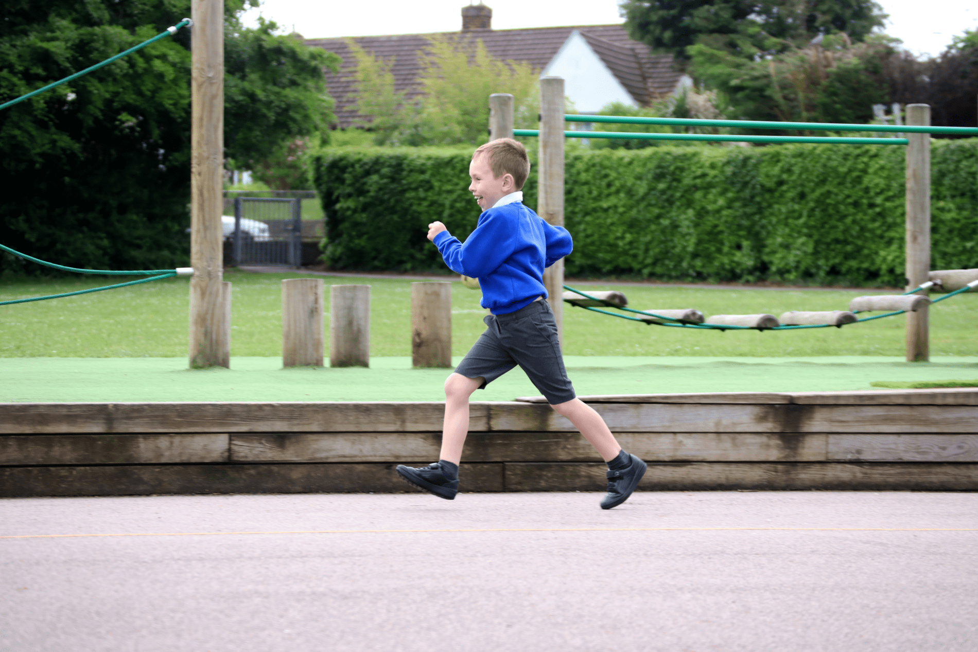 running pupil running on the playgrounf as part of the daily mile at horton kirby primary school