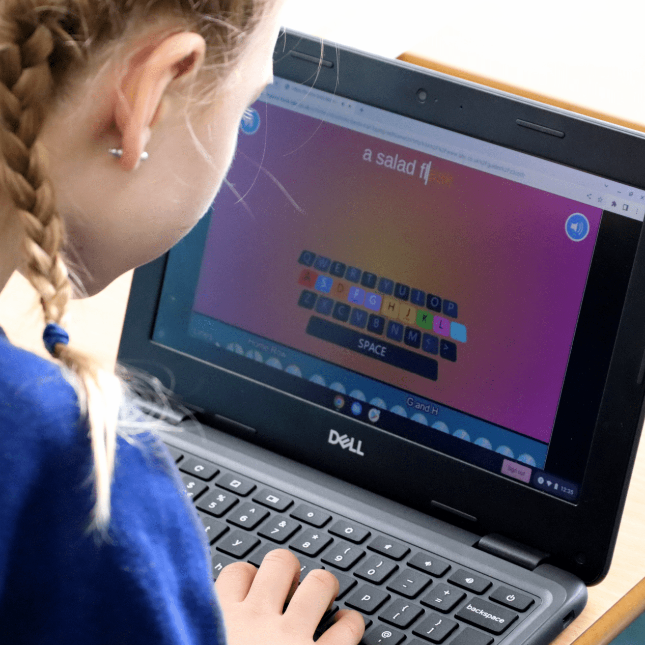 Phonics computing pupil using a laptop to learn phonics at horton kirby primary school