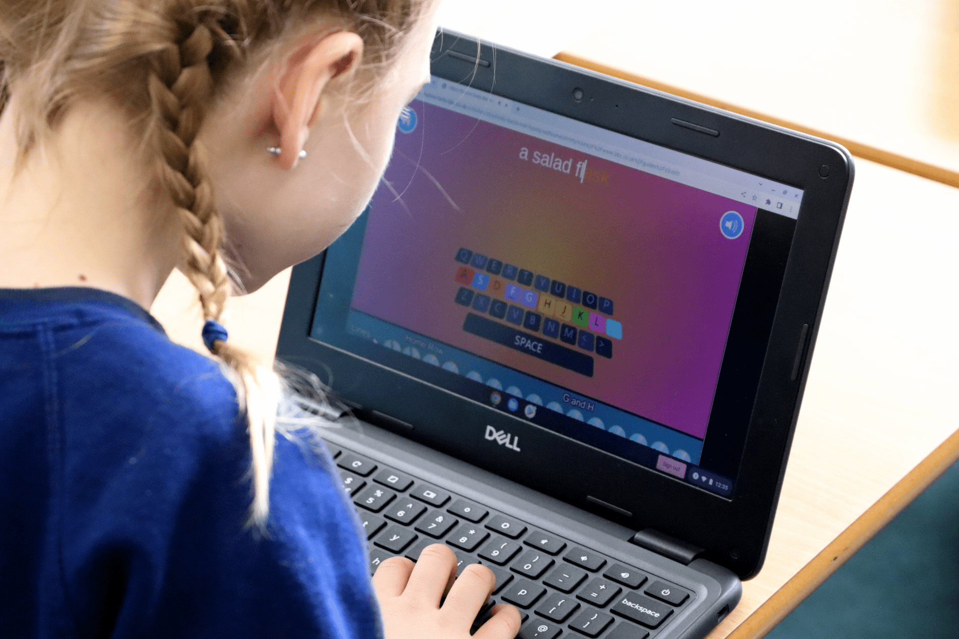 Phonics computing pupil using a laptop to learn phonics at horton kirby primary school