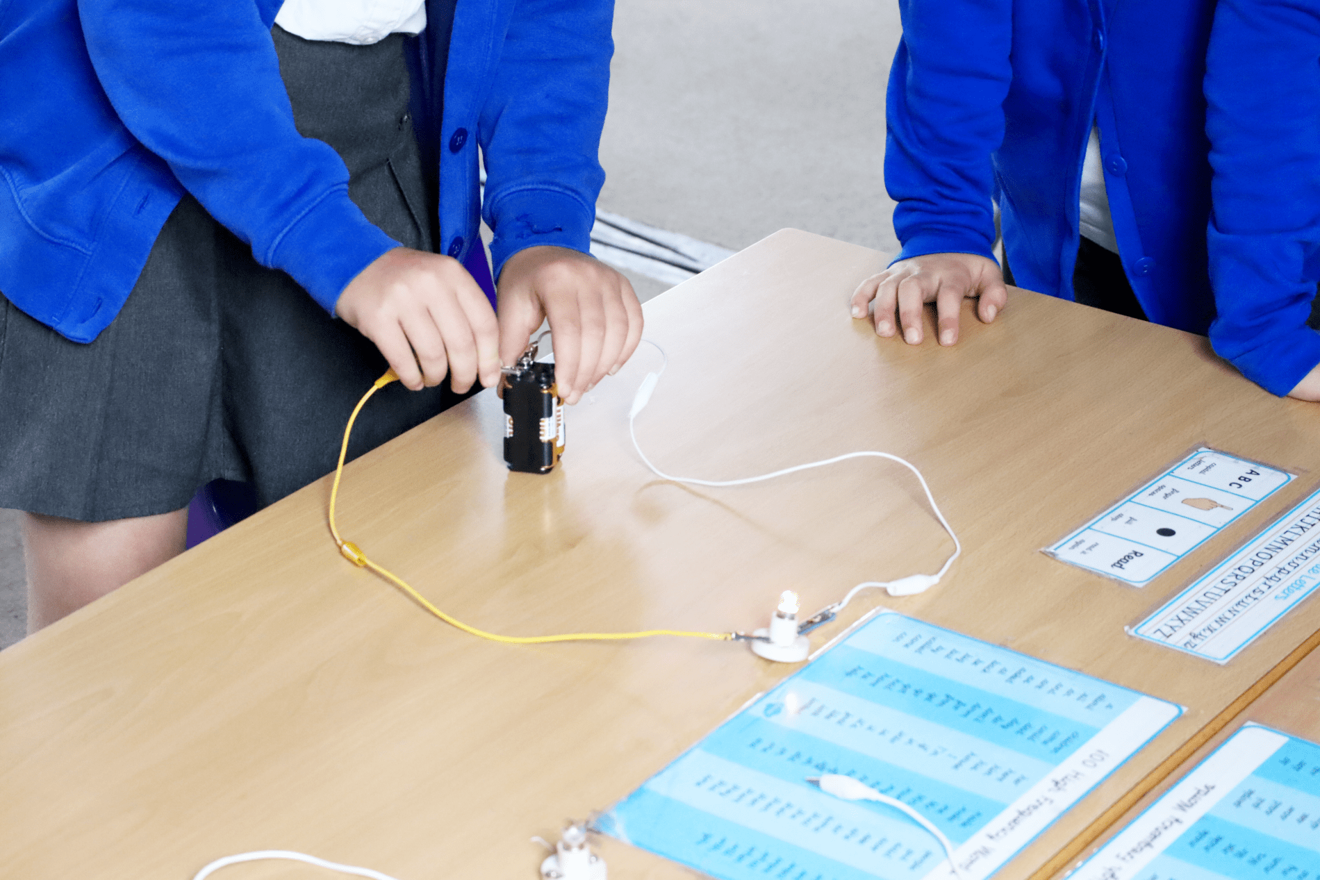 pupils setting up circuit to make lights work in science class at horton kirby primary school