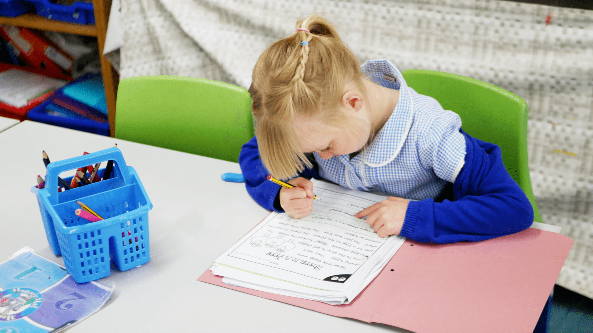 pupil writing pupil writing on a worksheet at horton kirby primary school