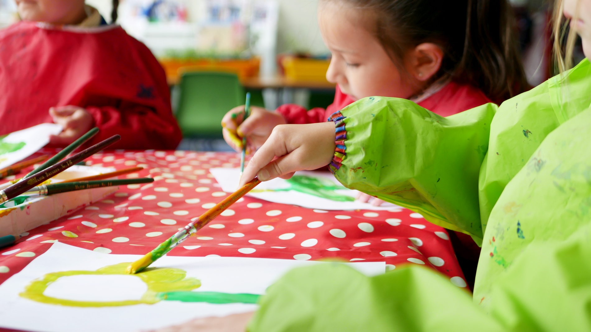 pupil painting a sunflower in EYFS at horton kirby primary school