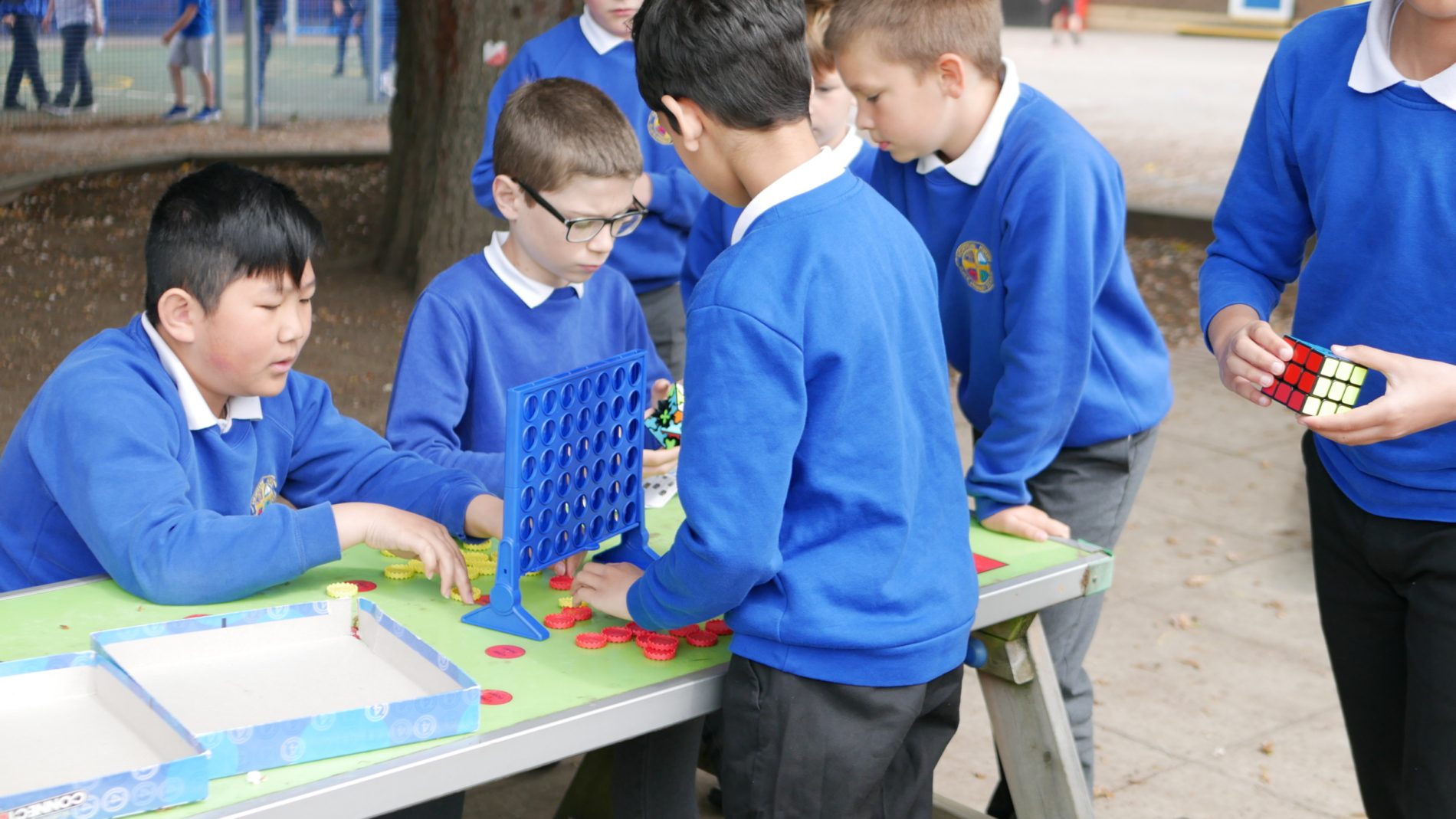 pupils playing at lunchtime with a variety of games at horton kirby primary school