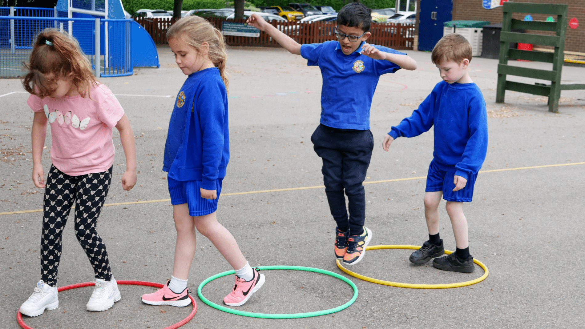 PE hoops pupils hopping into hoops as part of a PE lesson at horton kirby primary school