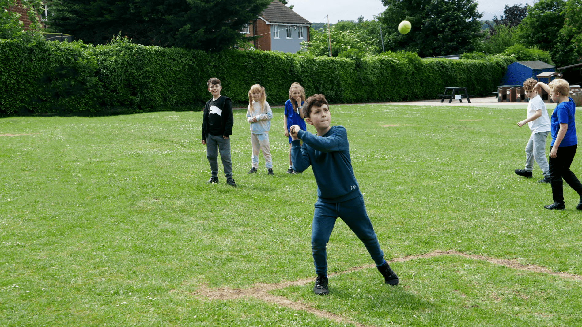 PE lesson pupil preparing to hit a ball during a game of rounders in PE at horton kirby primary school