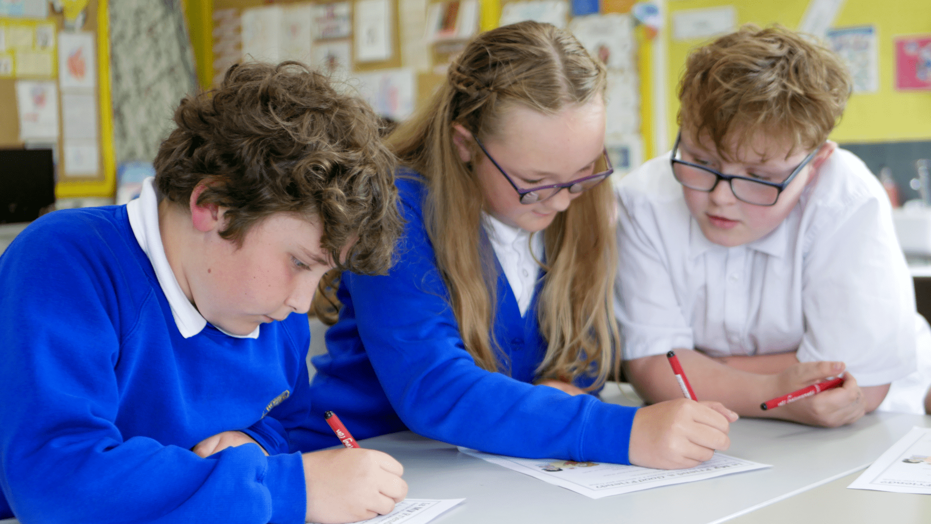 PSHE kids three pupils working together to complete PSHE questions at horton kirby primary school